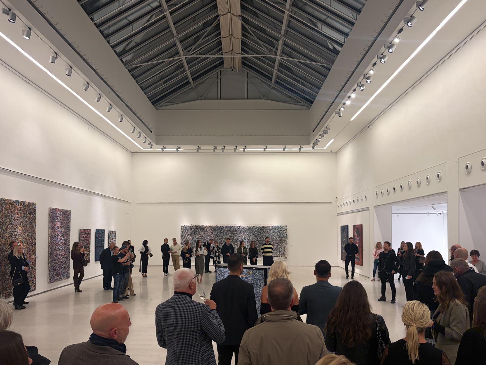 Visitors gathered for the opening of Anima Mundi at Galerie Mánes